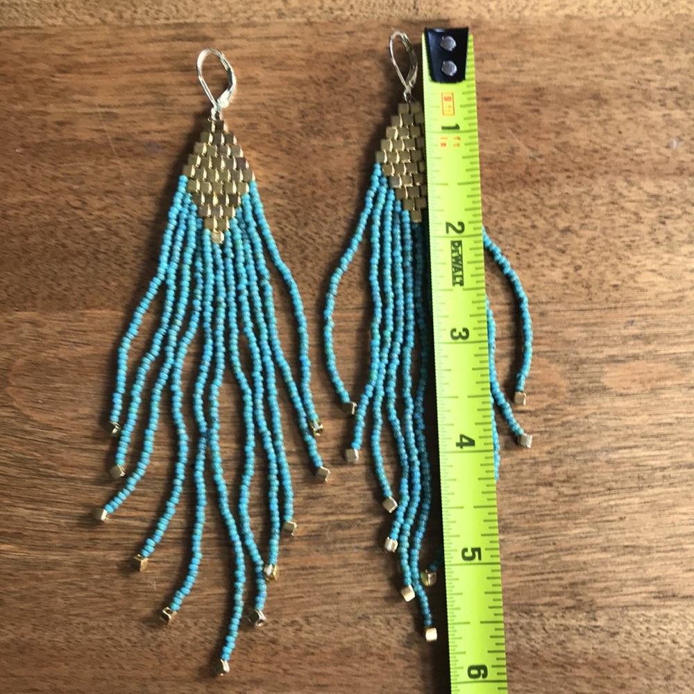 Long gorgeous indigenous made needed earrings from Western Montana.
